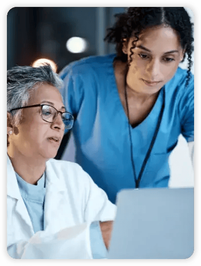 A doctor and nurse discussing patient data